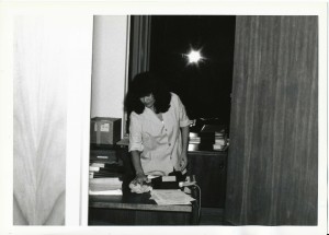 A female janitor cleaning an office