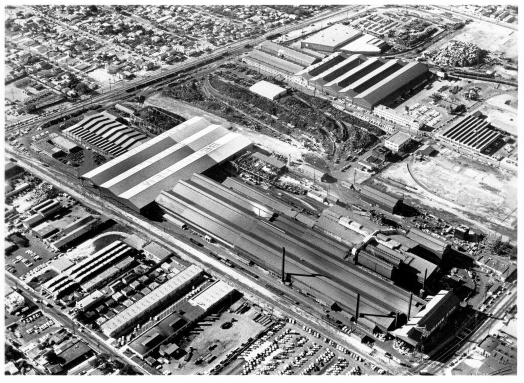black and white aerial photograph of a large industrial facility
