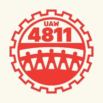 red logo resembling a gear with paper doll sequence silhouette across the face. Text reads "UAW 4811"